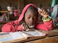 Girl studying at her school desk in Kenya